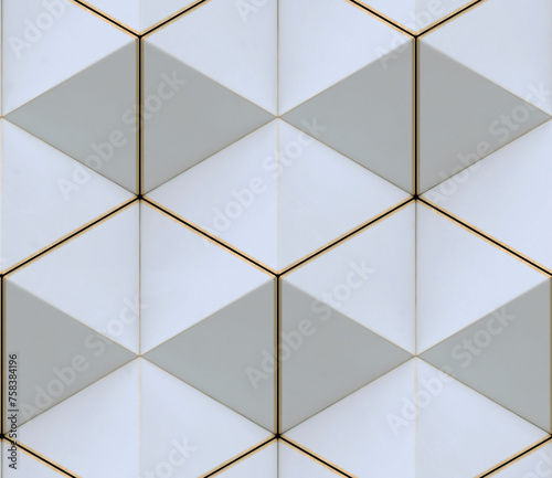 3D wall of white triangles with gold edges in the loft style assembled in hexagons and seamless ornament
