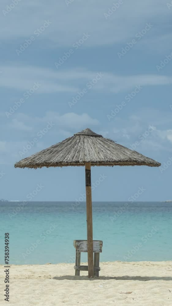Timelapse of stunning maragkas beach in naxos island greece with sun umbrellas in vertical Timelapse of stunning maragkas beach in naxos island greece with sun umbrellas in vertical