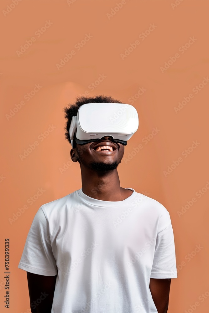 Happy young man immersed in virtual reality Happy young man immersed in virtual reality