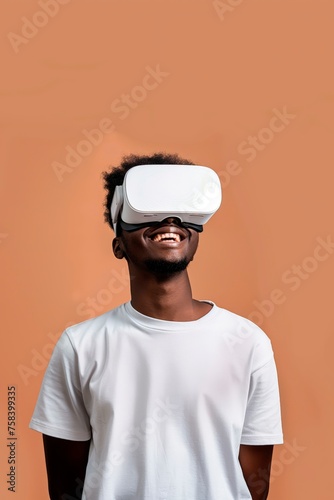 Happy young man immersed in virtual reality