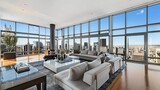 A penthouse oasis with floor-to-ceiling windows, offering unparalleled city views.  attractive look