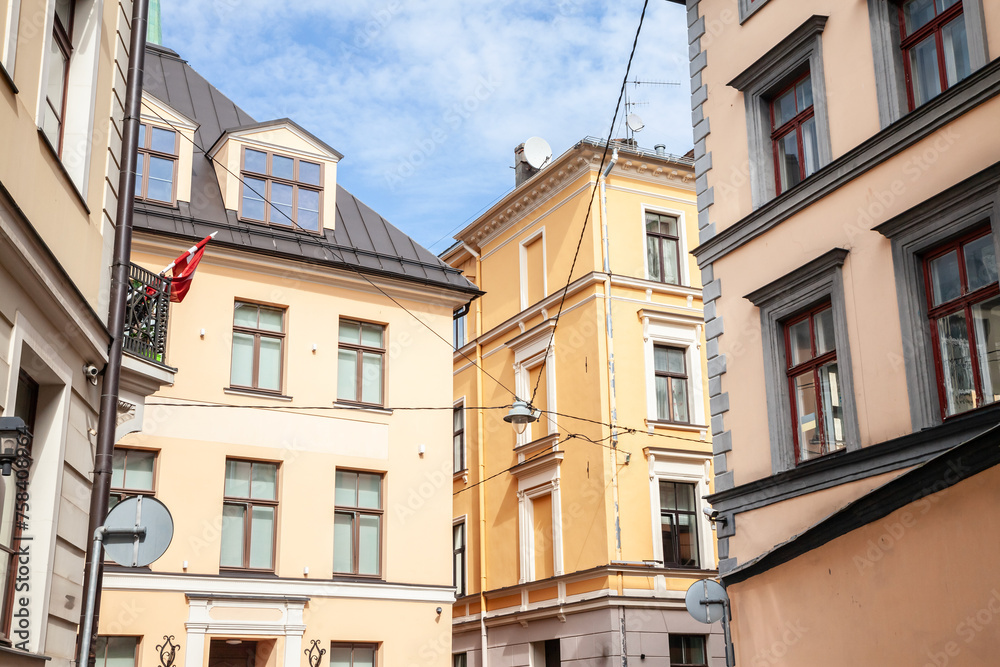 Vintage stone buildings, residential facades, in a typical street in Riga, in Vecriga Vecpilseta, the historical center old town of Latvian capital city.