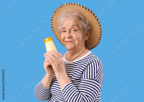 Senior woman with sunscreen...