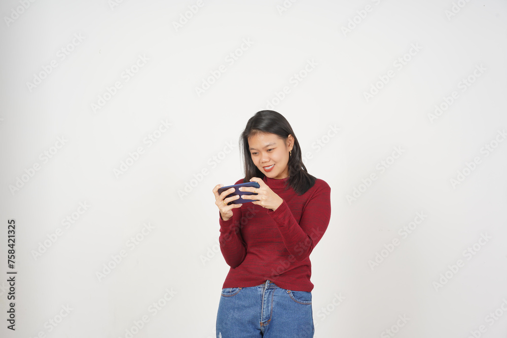 Young Asian woman in Red t-shirt Playing mobile game on smartphone isolated on white background Young Asian woman in Red t-shirt Playing mobile game on smartphone isolated on white background