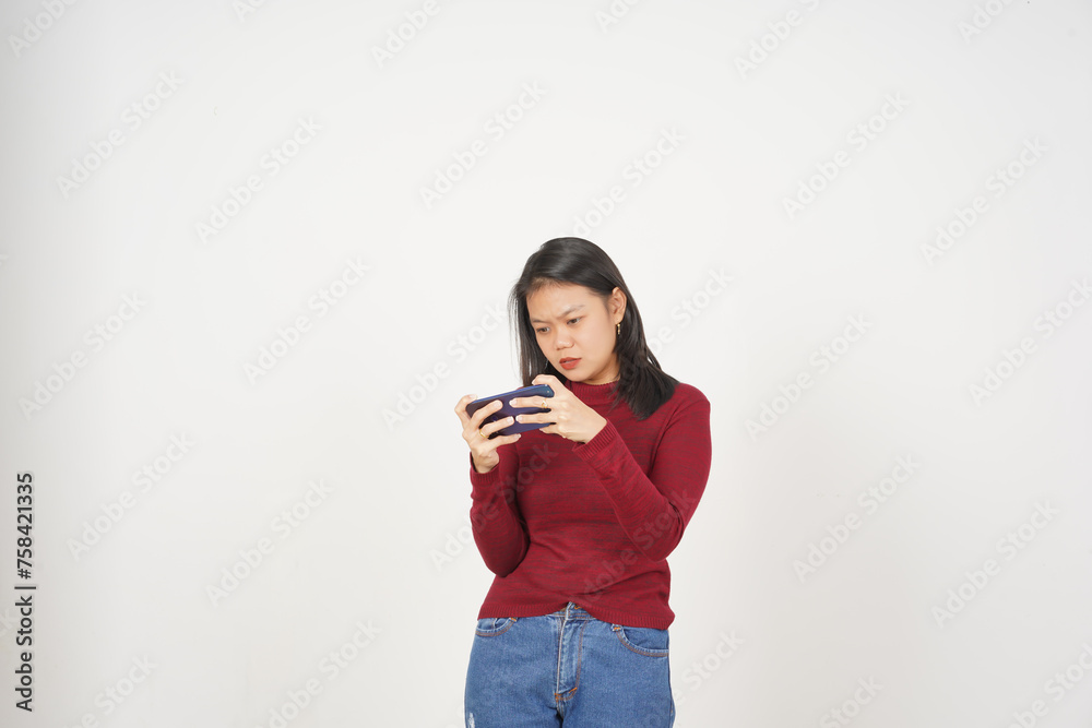 Young Asian woman in Red t-shirt Playing mobile game on smartphone isolated on white background Young Asian woman in Red t-shirt Playing mobile game on smartphone isolated on white background