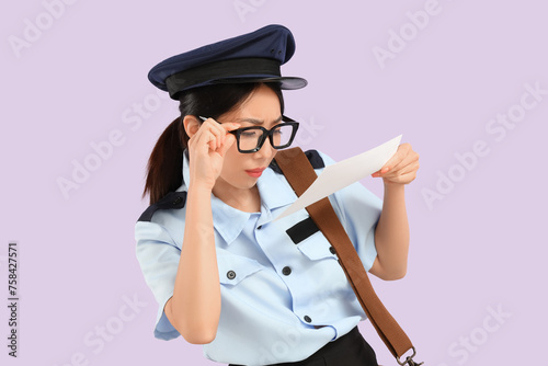 Young Asian postwoman with ...