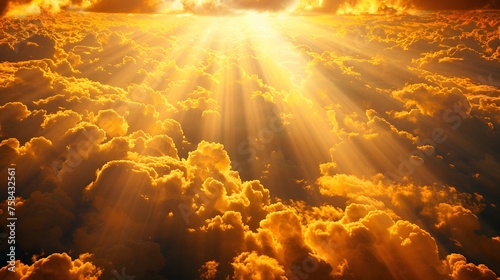 God light. Dramatic golden cloudy sky with sun beam. Yellow sun rays through golden clouds. God light from heaven for hope and faithful concept. Believe in god. Beautiful sunlight sky background. 