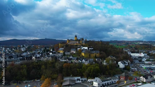 Aerial view around the old town and castle of the city  Montabaur in Germany on a cloudy day in autumn	
 photo