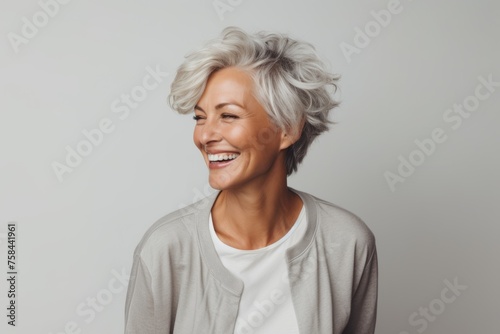 Smiling senior woman looking at copy space. Portrait of happy mature woman with gray hair.