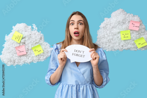 Excited young woman holding...