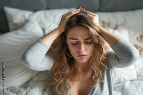 Woman with headache in bed