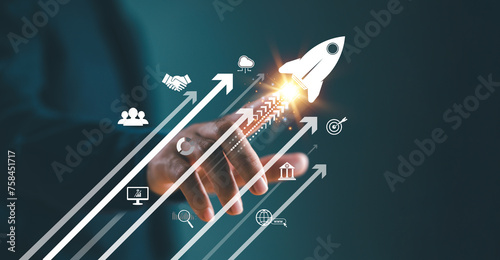 Growth strategy busines trend concept. Businessman hand on arrow investment icon. Increase sale marketing, increase success potential, soar rocket towards wealth. Competitive business goal plan .