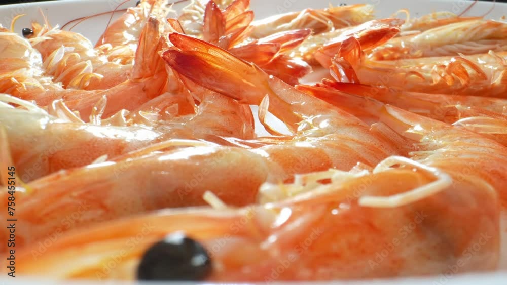 Boiled shrimp with shell: delightful dish with unique texture and flavor. Fresh shrimp boiled in seasoned water until pink and tender. Shell intact for added flavor and moisture. Shrimp background. Boiled shrimp with shell: delightful dish with unique texture and flavor. Fresh shrimp boiled in seasoned water until pink and tender. Shell intact for added flavor and moisture. Shrimp background.