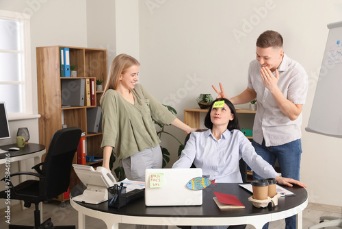 Office colleagues playing a...