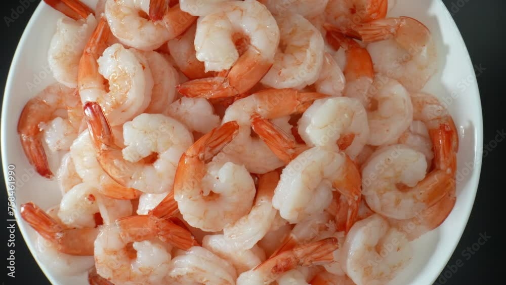 Frozen shrimp: mild, sweet flavor with hint of brininess. Versatile for cooking, easily adopt flavors of other ingredients or seasonings. Shot with 24mm probe macro lens. Shrimp background. 4K.
Frozen shrimp: mild, sweet flavor with hint of brininess. Versatile for cooking, easily adopt flavors of other ingredients or seasonings. Shot with 24mm probe macro lens. Shrimp background. 4K.