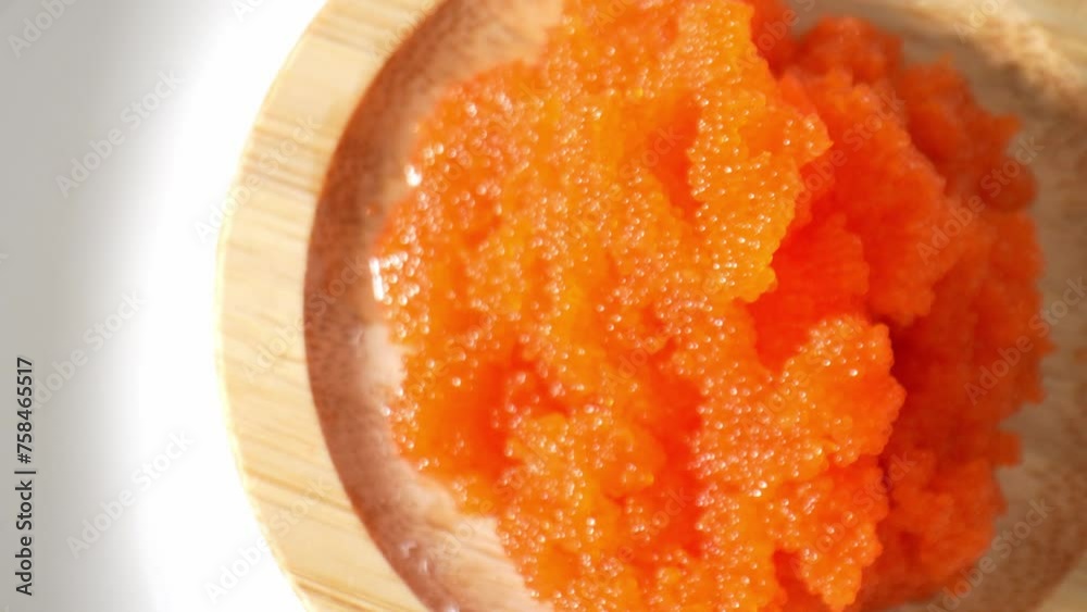 Tobiko: Japanese sushi staple, tiny orange fish roe. Adds vibrant color, delicate texture, and oceanic flavor to dishes. Seafood concept. Shot with 24mm probe macro lens. Tobiko background. 4K HDR. Tobiko: Japanese sushi staple, tiny orange fish roe. Adds vibrant color, delicate texture, and oceanic flavor to dishes. Seafood concept. Shot with 24mm probe macro lens. Tobiko background. 4K HDR.