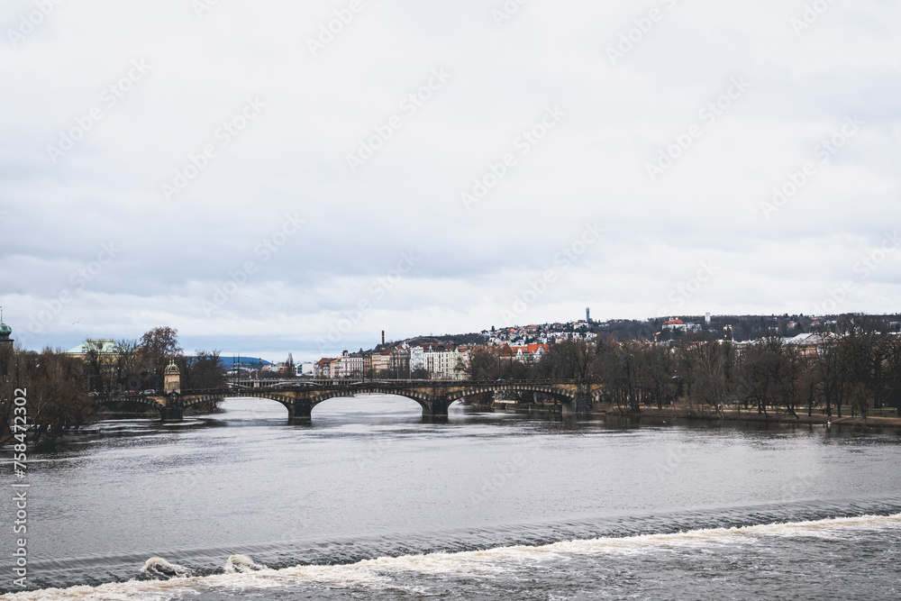 Old Czech bridges and wide rivers in winter.