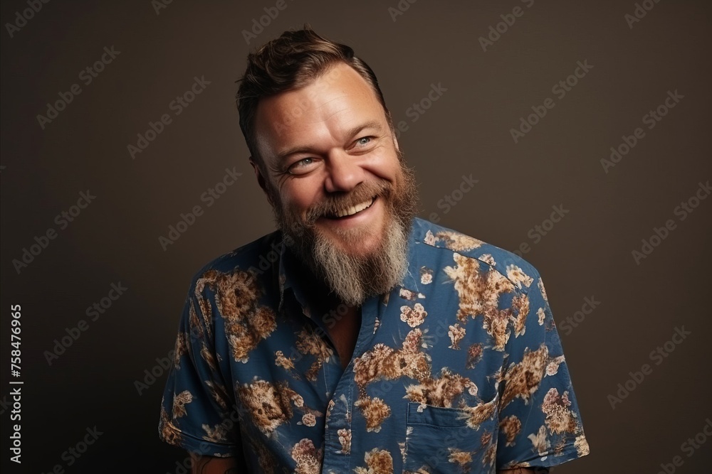 Portrait of a smiling middle-aged man in a blue shirt Portrait of a smiling middle-aged man in a blue shirt