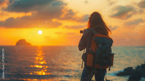 A lone traveler with a backpack watches the sunset over the ocean, capturing a moment of wanderlust and reflection.