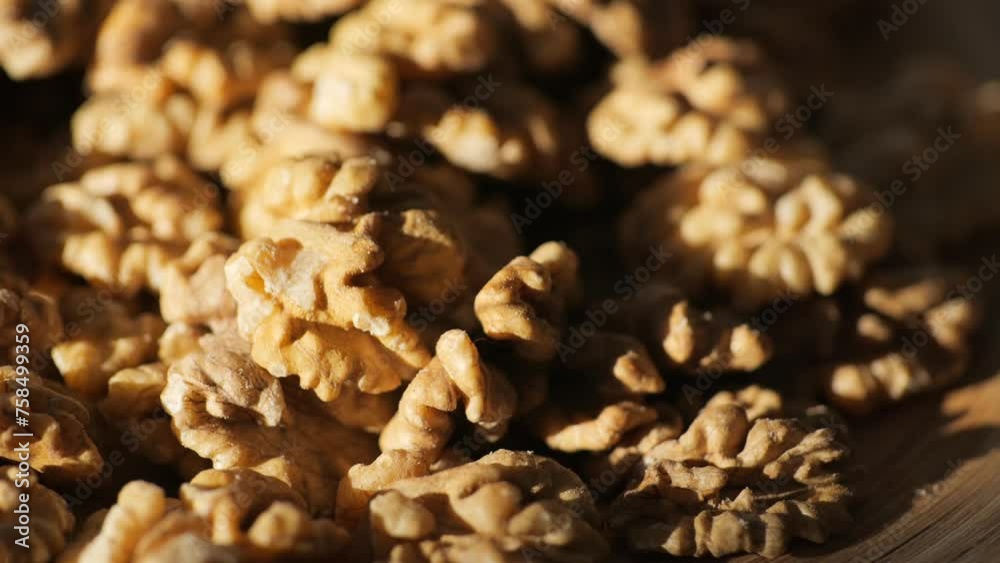Walnut kernels rotating. walnut close up lies under beams of the sun. Walnut close up. product rich in minerals and vitamins. Macro 4K Walnut kernels rotating. walnut close up lies under beams of the sun. Walnut close up. product rich in minerals and vitamins. Macro 4K