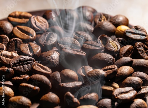 Roasted coffee beans. Seeds of freshly roasted coffee with smoke