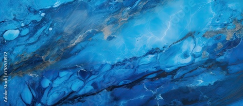 A close up view of a vibrant electric blue marble texture resembling a liquid water pattern, evoking a natural landscape with marine biology elements underwater