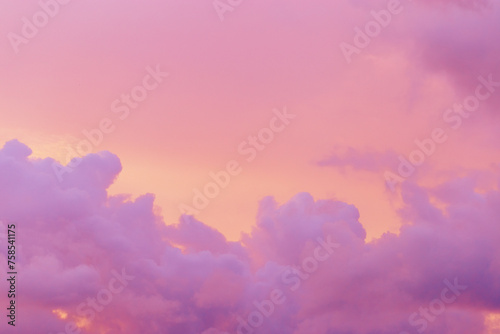Pastel nature Sunset, purple fluffy clouds on pink colored sky, picturesque landscape pastel tones, soft colorful scenery with vanilla sky, beautiful sunlight lighting heaven in bright colors