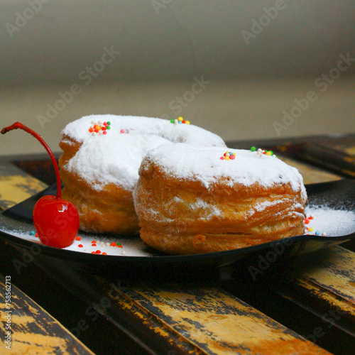 The Cronut (a portmanteau of croissant and doughnut) is a pastry created and trademarked in 2013 by the French pastry chef Dominique Ansel. It resembles a doughnut and is made from croissant-like doug photo