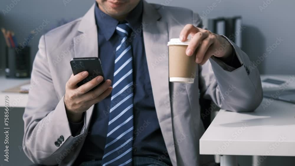 A beautiful Asian employee is spending time in his private office while taking a break from his day, A scene of a male employee taking a break from his job at a company. A beautiful Asian employee is spending time in his private office while taking a break from his day, A scene of a male employee taking a break from his job at a company.