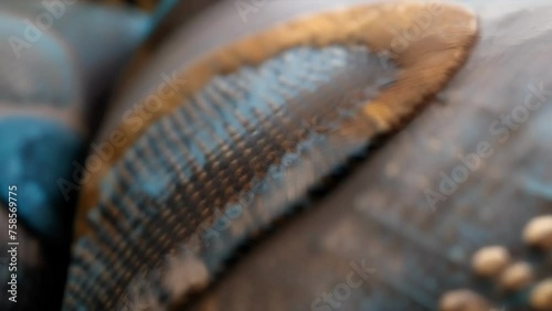 A macro image of a home decor piece such as a pillow or throw featuring etextile embellishments that add a touch of modernity and sophistication to a traditional design. photo