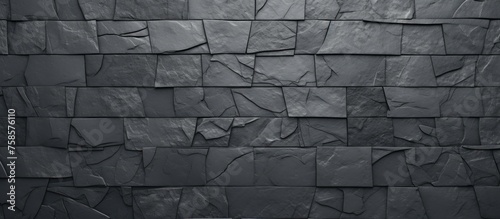 A closeup shot of a rectangular grey brick wall with parallel brickwork patterns. The monochrome photography highlights the texture of the stone wall