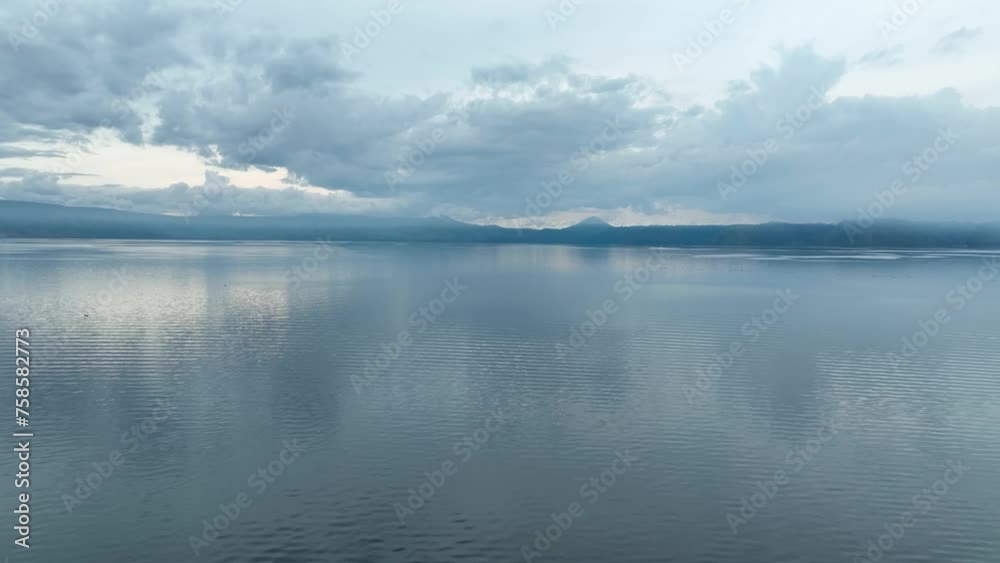 Still reflections of the skyline over picturesque Lake Toba. Aerial Still reflections of the skyline over picturesque Lake Toba. Aerial