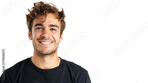 A young adult with tousled hair grinning wearing a simple black t-shirt, against white