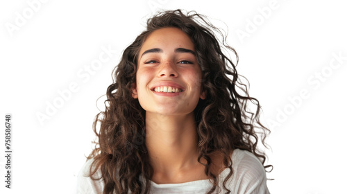 A cheerful woman in a white top with curly hair laughs openly on a white background photo