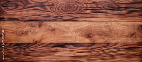 A closeup of a brown hardwood plank with a beautiful grain pattern, possibly used for flooring. The rectangle piece of wood shows the natural beauty of the lumber