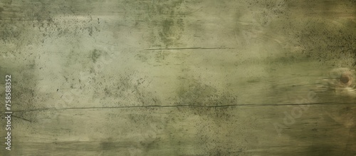 A close up of a beige concrete wall with parallel rectangular patterns, showcasing tints and shades. The blurred background adds a sense of symmetry