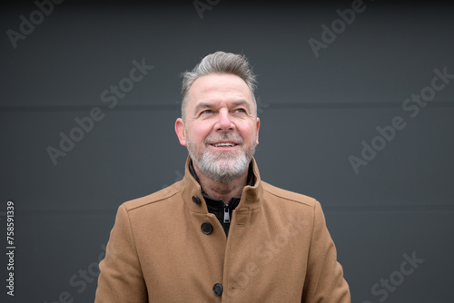 Portrait of a middle-aged man looking friendly up