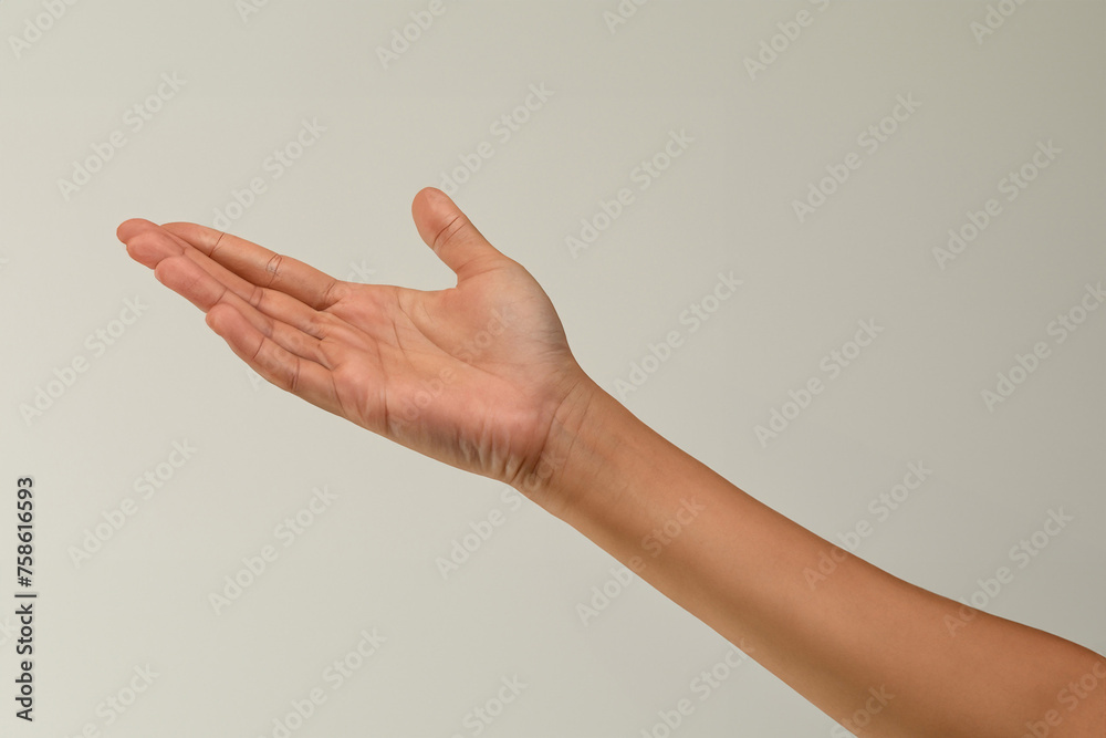 Female hand isolated on white background. Close-up of female hand gesturing