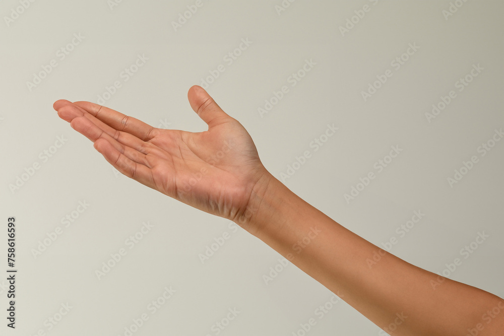 Female hand isolated on white background. Close-up of female hand gesturing Female hand isolated on white background. Close-up of female hand gesturing
