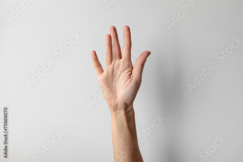 Woman showing five fingers on light background, closeup. Sign language © Robert Kiyosaki