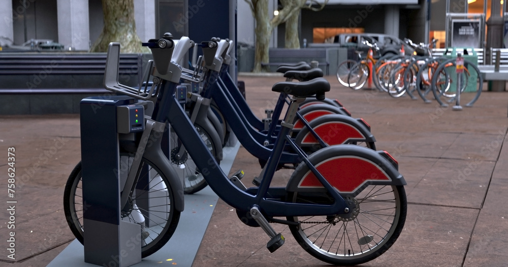 Generic Electric bicycle charging station. Shared electric bikes parked for rent on city street Generic Electric bicycle charging station. Shared electric bikes parked for rent on city street