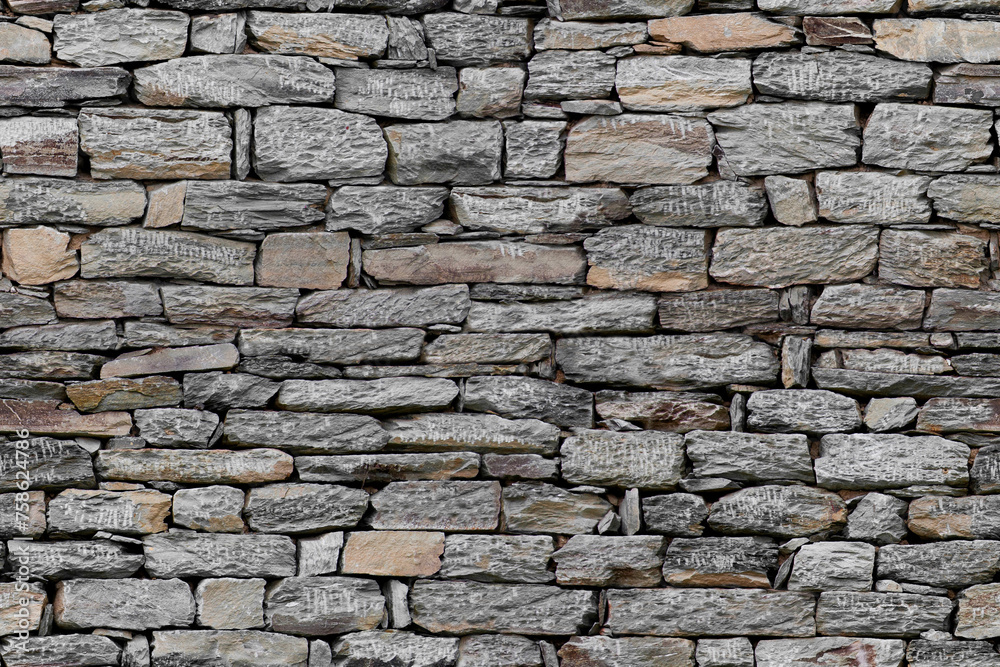 Fototapeta premium The wall is made of natural stone. Can be used as a background. Seamless texture