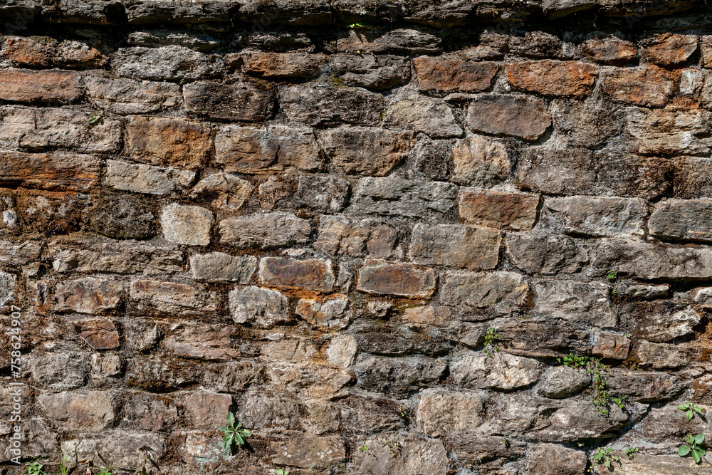 Wall built of natural stone. Can be used as background Wall built of natural stone. Can be used as background