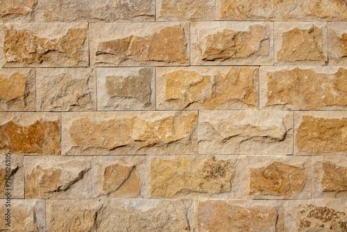 A natural stone wall can be used as a background