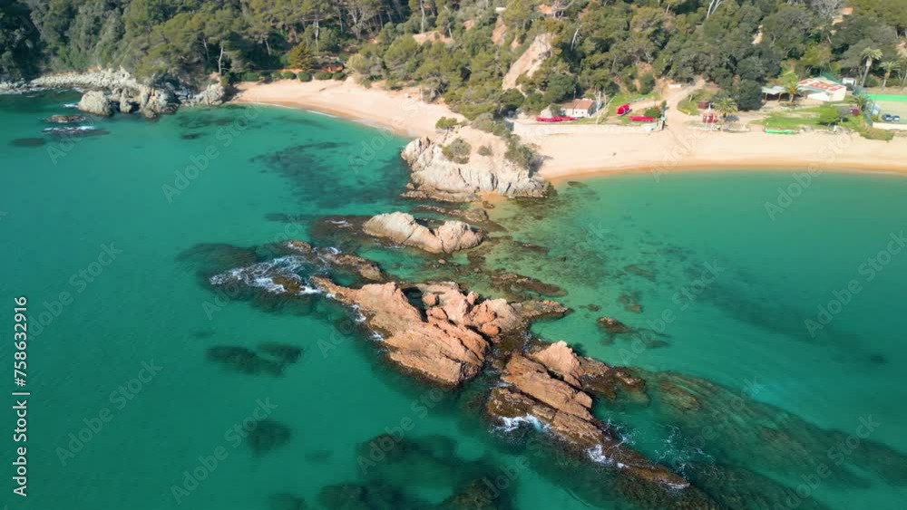 Explore Lloret De Mar's aerial wonders, revealing the mesmerizing blend of transparent blue waters and luxurious tourist spots such as Santa Cristina and Cala Treumal. Explore Lloret De Mar's aerial wonders, revealing the mesmerizing blend of transparent blue waters and luxurious tourist spots such as Santa Cristina and Cala Treumal.