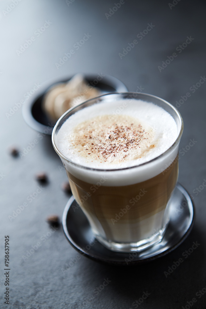 Coffee with milk on dark stone background. Close up. Coffee with milk on dark stone background. Close up.