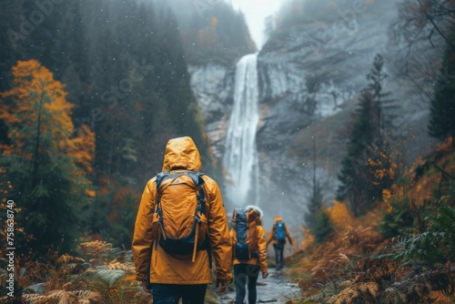 Autumn Adventure: Friends on a Misty Trail to a Secluded Waterfall