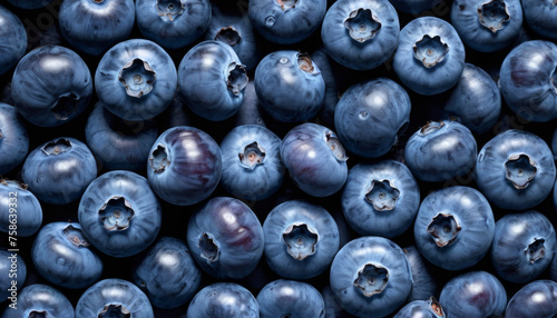 A detailed view of ripe blueberries with distinct holes in the center, possibly caused by insects or natural growth patterns. photo