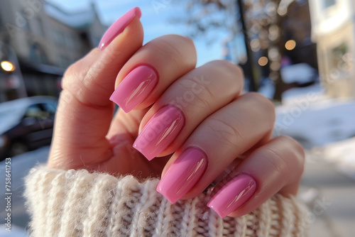 Female hand with pink nail design  Nail Polish. Art Manicure. Modern style pink Nail Design.