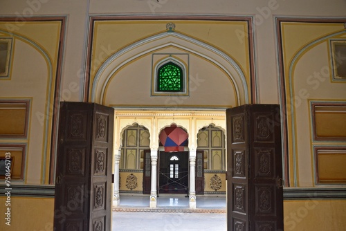 A sequence of intricately designed arched doorways open to a tranquil courtyard, Nahargarh Fort, Jaipur, Rajasthan, India 